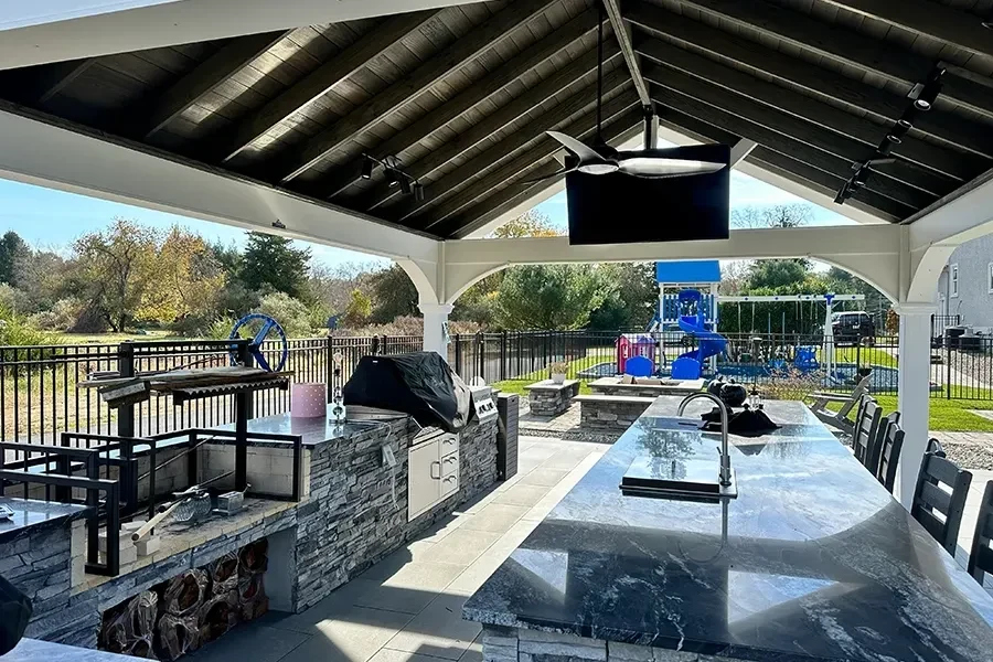 Covered outdoor kitchen and dining space